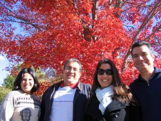 Acadia Center English immersion course students enjoying a hiking excursion in Maine during the peak of fall foliage.