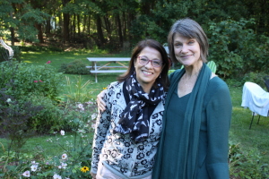 Acadia Center English immersion course student and teacher in the school garden.