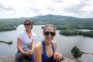 Acadia Center students overlooking lake and mountains of Camden, Maine.