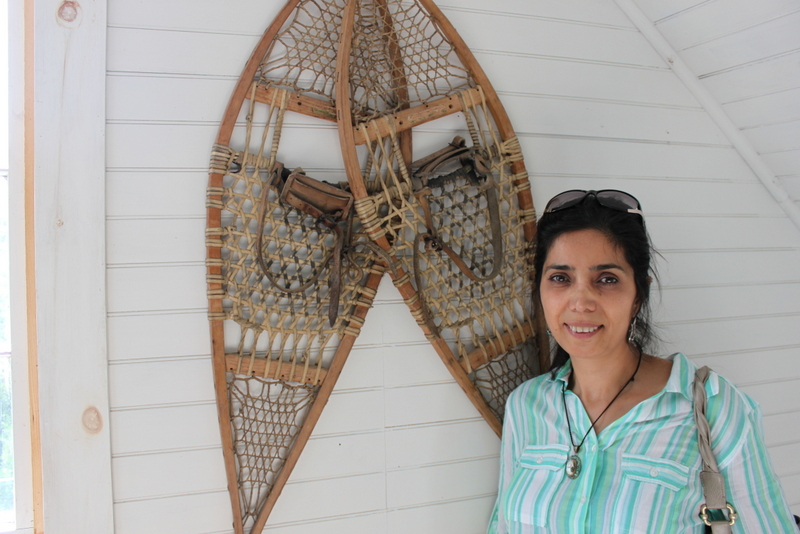Acadia Center English student - an architect from Turkey - with a pair of antique snowshoes.