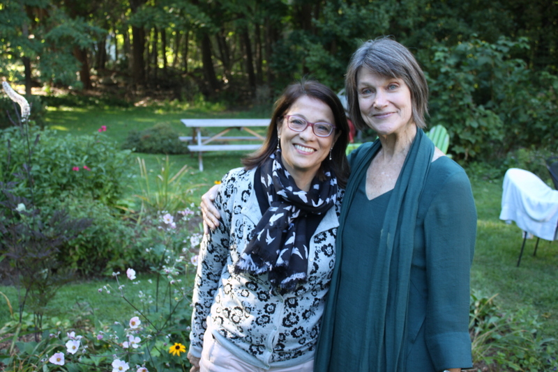 Student and teacher in school garden.